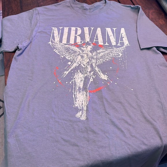 NWOT. Woman’s size L. (No size written but it’s L) Nirvana blue T-shirt. - Picture 3 of 3